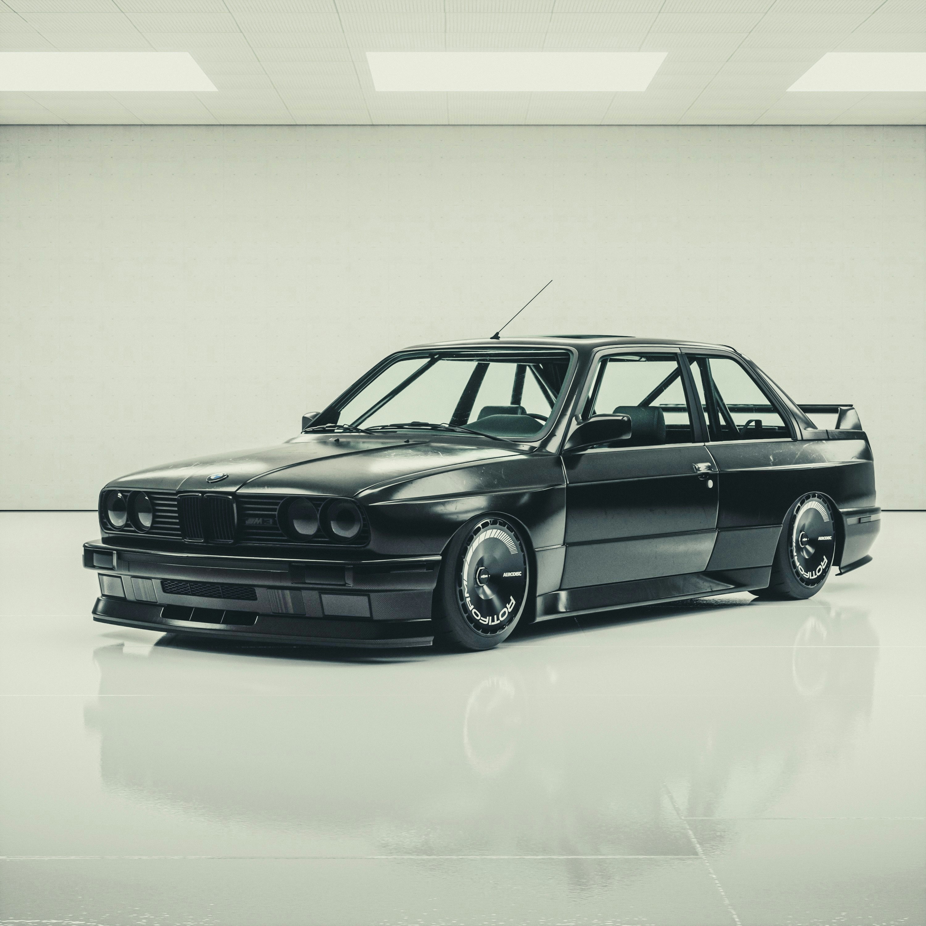 Black BMW E30 M3 in a clean studio environment